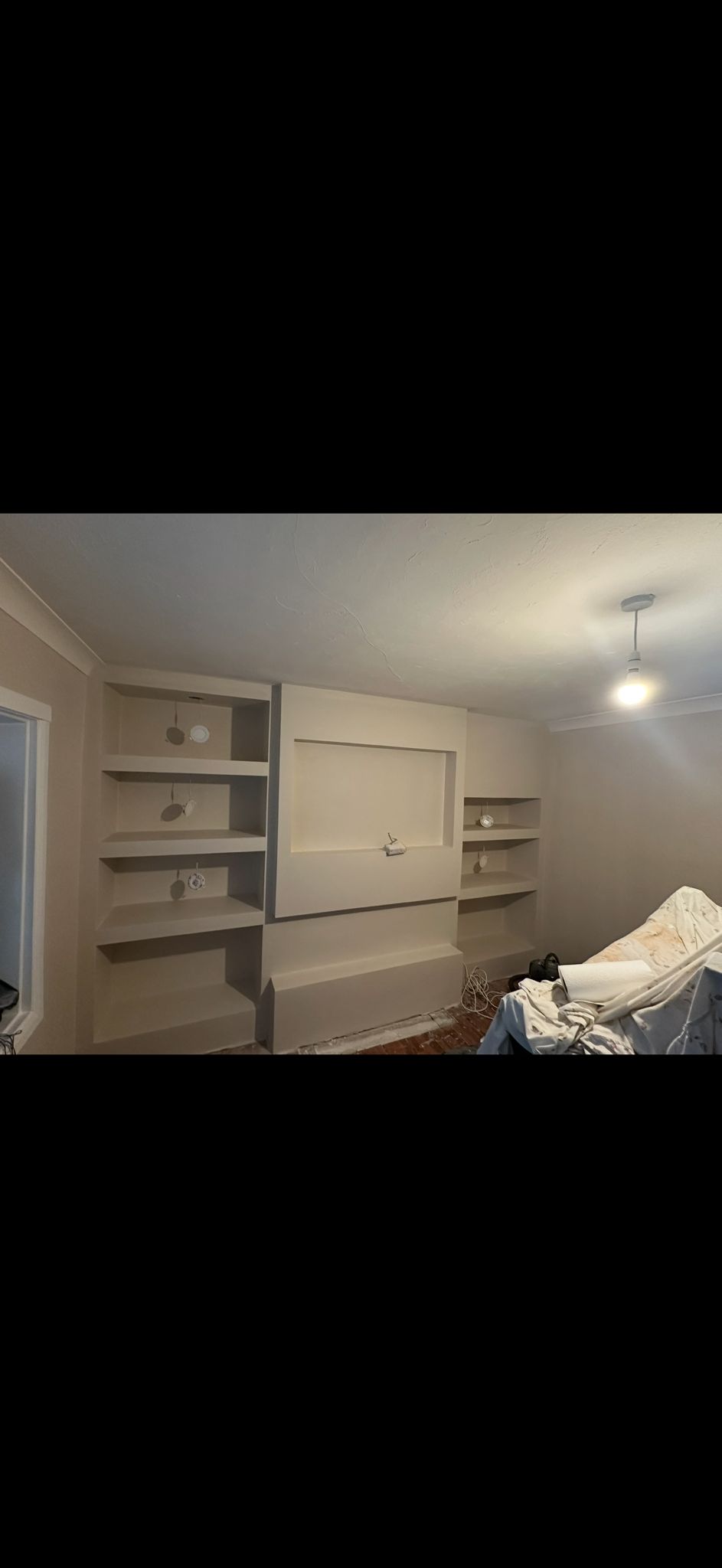 Bespoke built-in shelving unit and carpentry work in London home